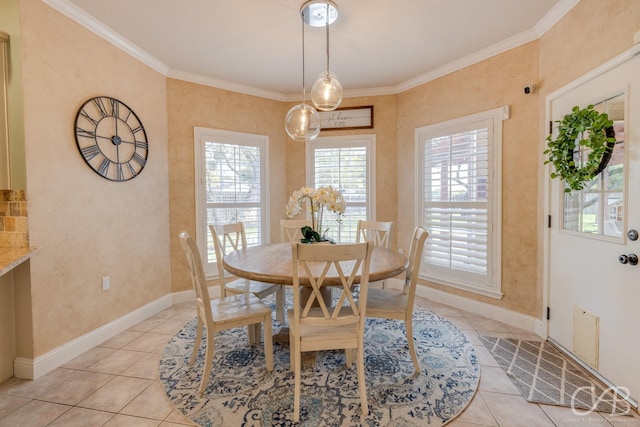 dining room with light tile patterned floors and ornamental molding