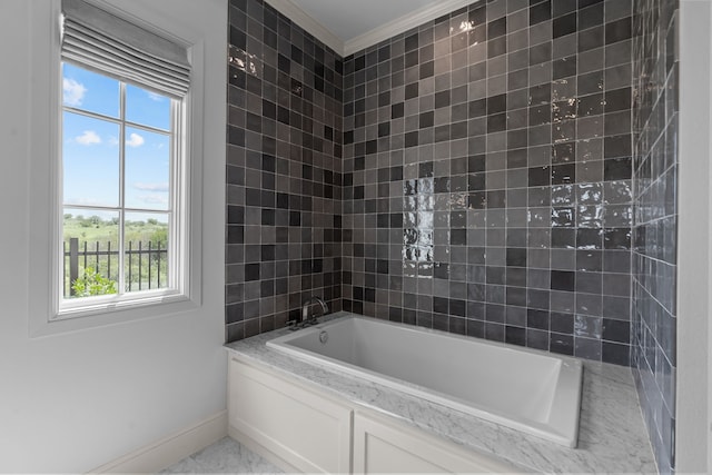 bathroom featuring a bathtub, crown molding, and a wealth of natural light