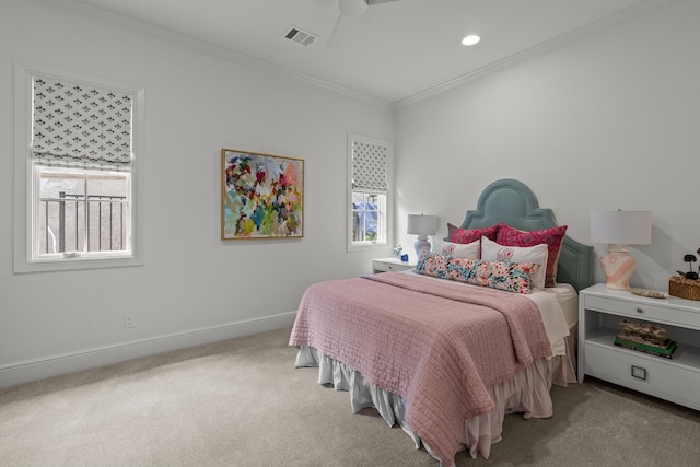 carpeted bedroom with multiple windows, ornamental molding, and ceiling fan