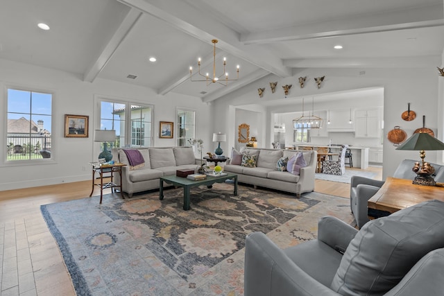 living room featuring vaulted ceiling with beams, light hardwood / wood-style flooring, and a notable chandelier