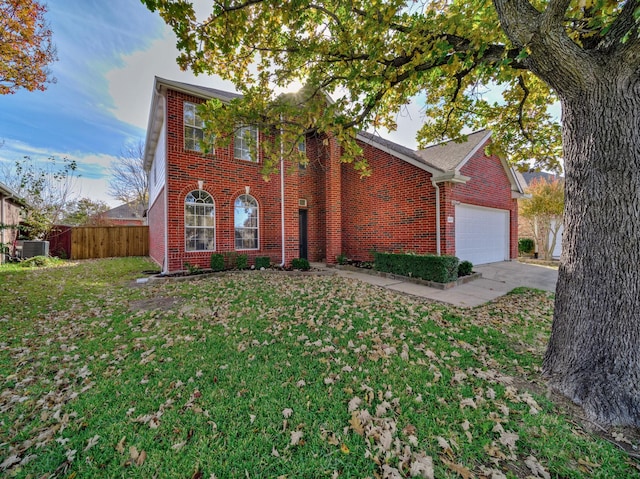 view of front of house with a garage and a front yard