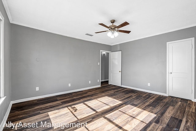 unfurnished bedroom with ceiling fan, ornamental molding, and dark hardwood / wood-style floors