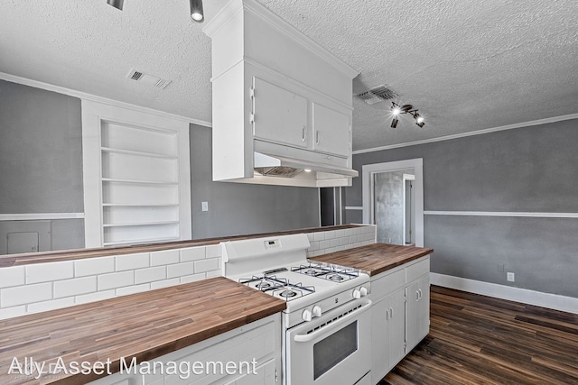 kitchen featuring white gas stove, white cabinets, dark hardwood / wood-style floors, and wood counters