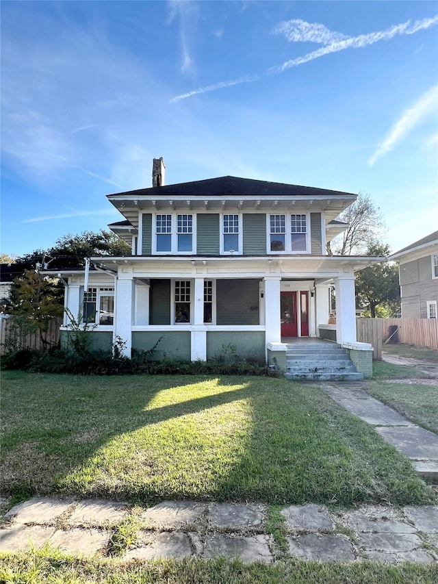 view of front facade featuring a front yard and a porch