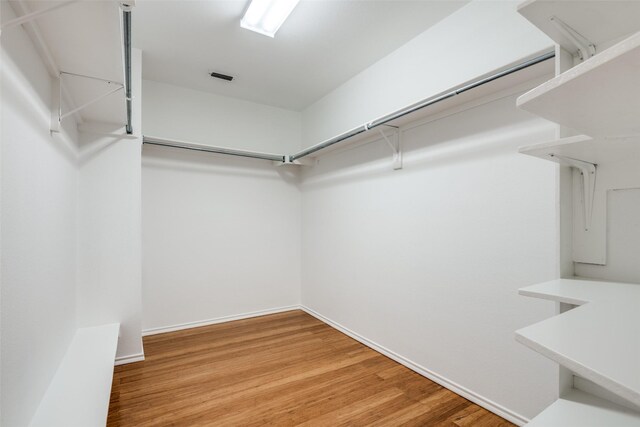 spacious closet with wood-type flooring