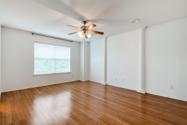 unfurnished room with hardwood / wood-style flooring and ceiling fan