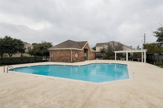 view of pool with a pergola and a patio area