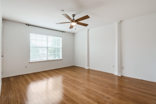 empty room featuring ceiling fan and hardwood / wood-style flooring