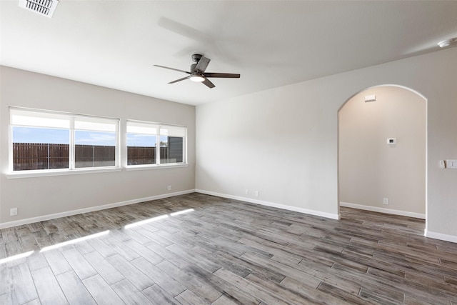 unfurnished room with ceiling fan and wood-type flooring