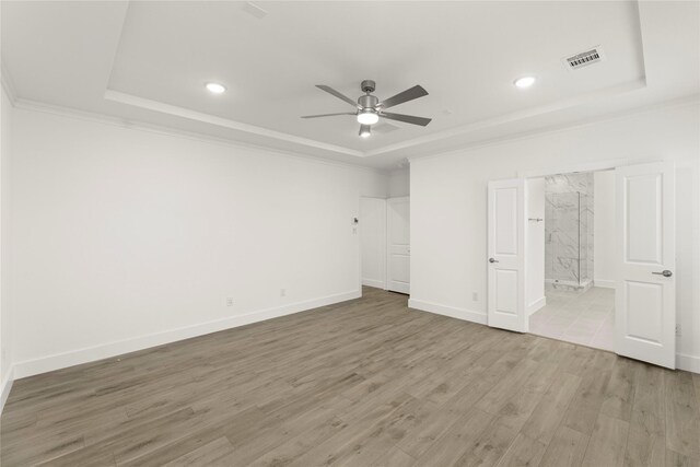 1385 Melcer St, Frisco, TX 75036 - unfurnished bedroom with ornamental molding, baseboards, a raised ceiling, visible vents, and wood finished floors