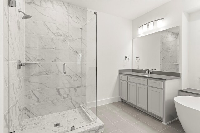 1385 Melcer St, Frisco, TX 75036 - full bath featuring a soaking tub, vanity, a stall shower, and baseboards