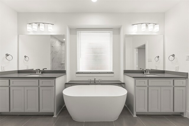 1385 Melcer St, Frisco, TX 75036 - full bath with a sink, tile patterned floors, and a soaking tub