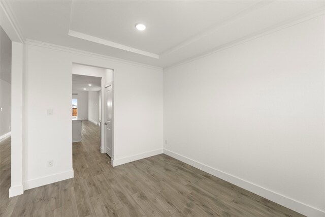 1385 Melcer St, Frisco, TX 75036 - unfurnished room featuring crown molding, a tray ceiling, recessed lighting, baseboards, and wood finished floors