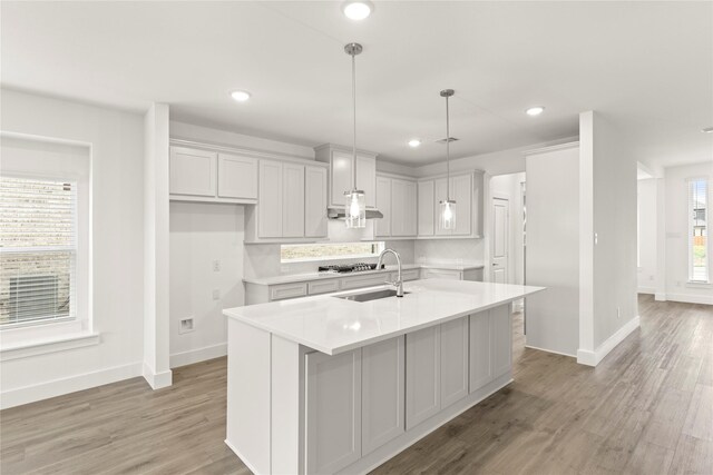 1385 Melcer St, Frisco, TX 75036 - kitchen with stainless steel gas cooktop, light countertops, recessed lighting, and light wood finished floors