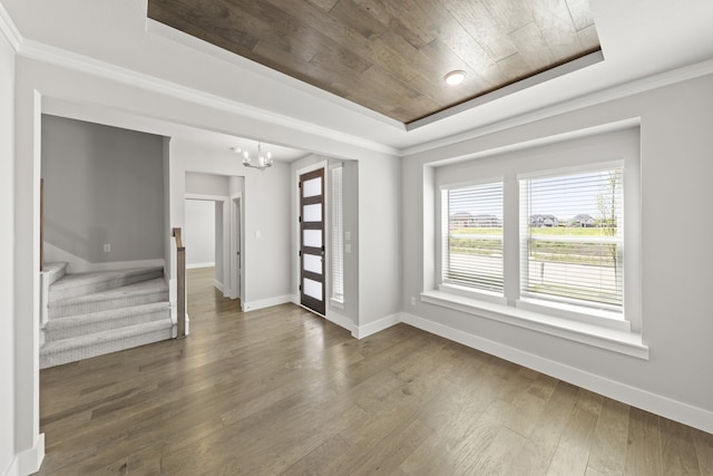 1590 Marburg Ln, Frisco, TX 75036 - spare room featuring wood ceiling, a chandelier, baseboards, a raised ceiling, and dark wood finished floors