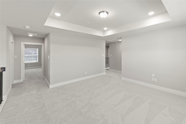 1590 Marburg Ln, Frisco, TX 75036 - spare room featuring a raised ceiling, light colored carpet, baseboards, and recessed lighting