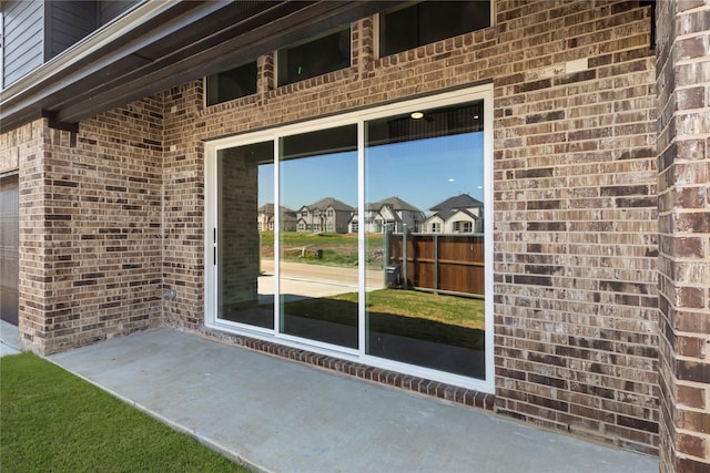 1590 Marburg Ln, Frisco, TX 75036 - view of exterior entry with brick siding and a residential view