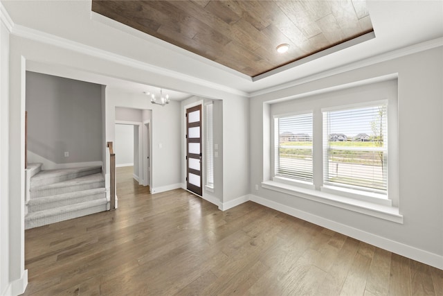 1590 Marburg Ln, Frisco, TX 75036 - unfurnished room featuring wood ceiling, a chandelier, wood finished floors, baseboards, and a tray ceiling