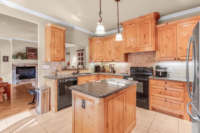 kitchen with ornamental molding, sink, black appliances, pendant lighting, and a kitchen island