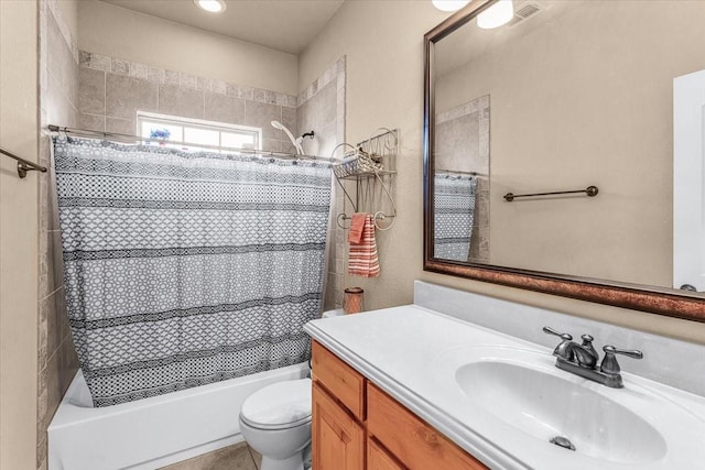 full bathroom featuring vanity, toilet, and shower / bath combo with shower curtain