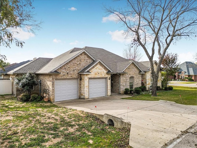 view of front facade with a garage and a front yard