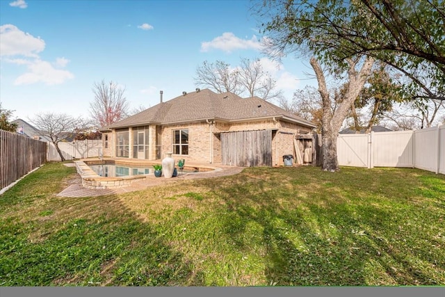 back of house with a fenced in pool and a lawn