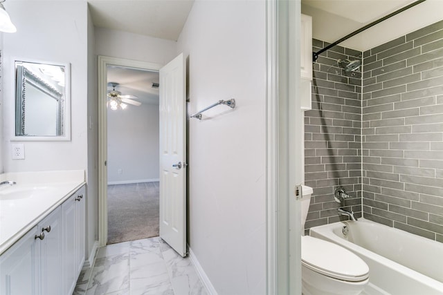 full bathroom with vanity, tiled shower / bath combo, and toilet