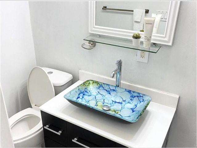 bathroom with vanity and toilet