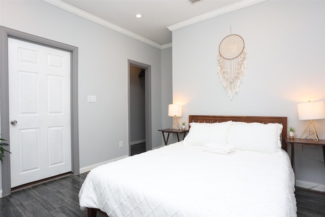 bedroom featuring crown molding and dark wood-type flooring