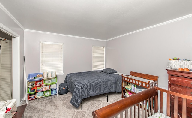 bedroom with crown molding and carpet