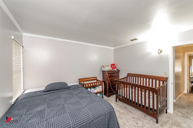 carpeted bedroom featuring crown molding