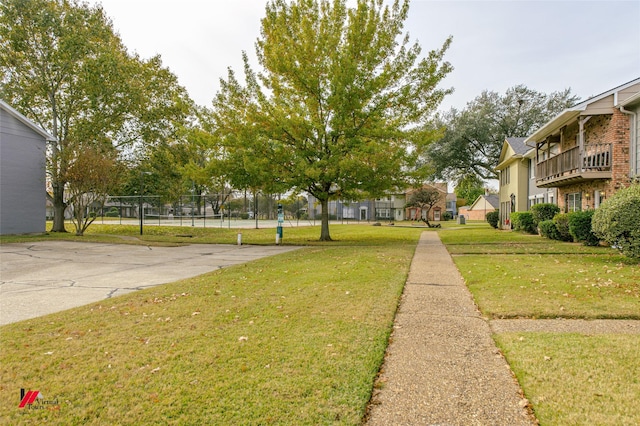 exterior space with tennis court