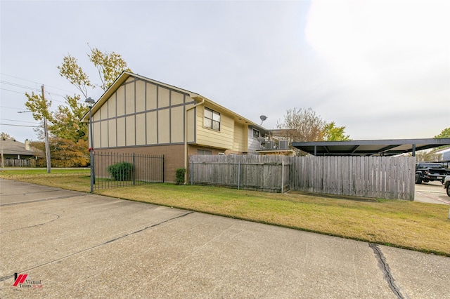 view of side of property with a yard