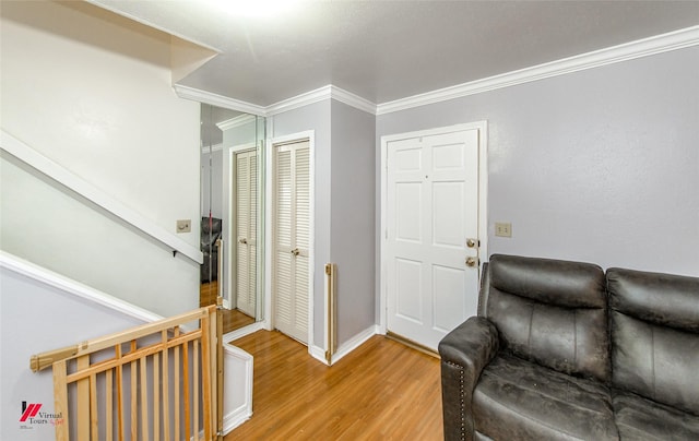 interior space with wood-type flooring and ornamental molding