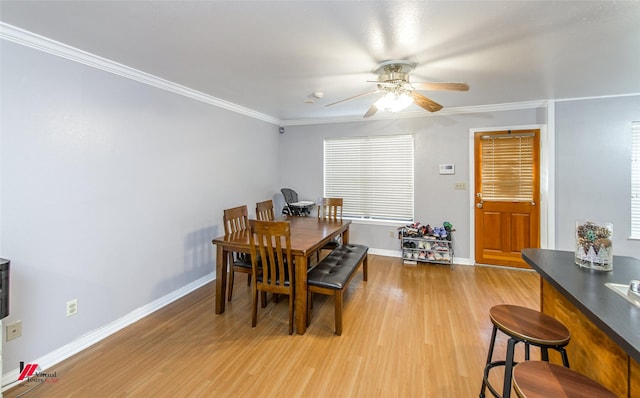 dining area featuring hardwood / wood-style flooring, ceiling fan, and ornamental molding