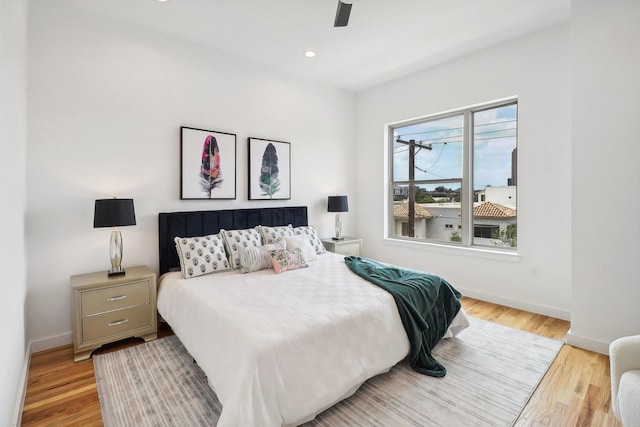 bedroom featuring light hardwood / wood-style floors and ceiling fan