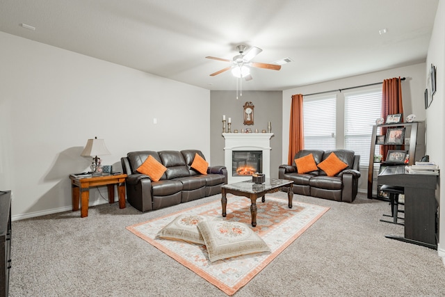 carpeted living room featuring ceiling fan