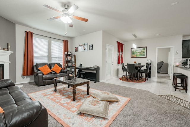 tiled living room with ceiling fan