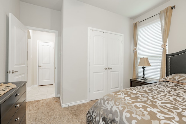 carpeted bedroom featuring a closet