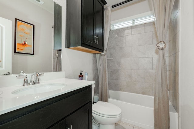 full bathroom featuring tile patterned flooring, shower / bath combination with curtain, toilet, and vanity