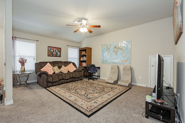 living room featuring carpet, plenty of natural light, and ceiling fan