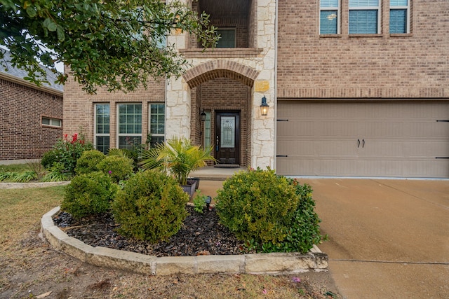 doorway to property with a garage