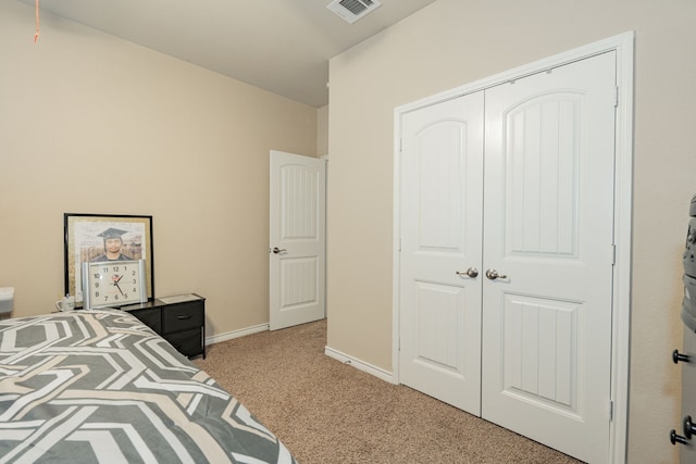 carpeted bedroom with a closet