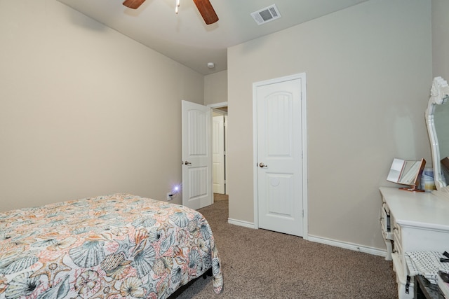 bedroom featuring ceiling fan and dark carpet