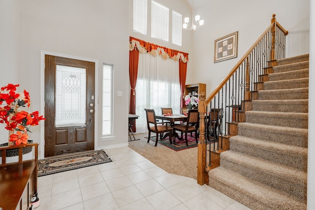 3204 Sunny Hill Way, Royse City, TX 75189 - entryway with a towering ceiling, stairs, a chandelier, light tile patterned floors, and light carpet