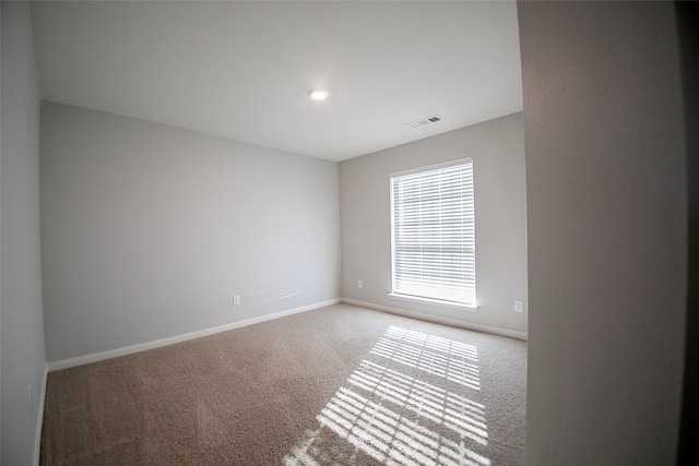 unfurnished room with carpet flooring