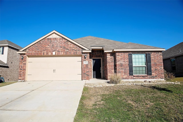 ranch-style house featuring a garage and a front lawn