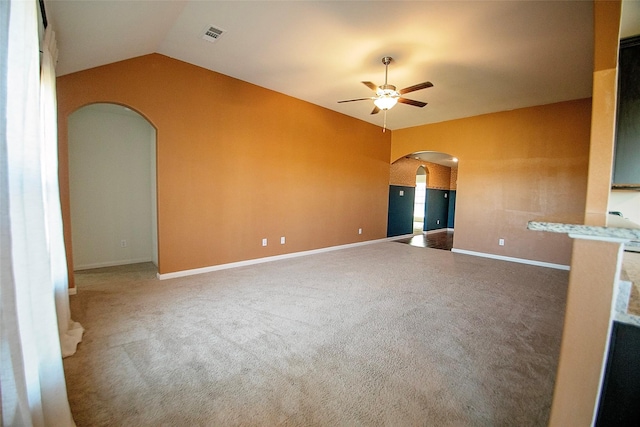 unfurnished living room with carpet flooring, ceiling fan, and lofted ceiling