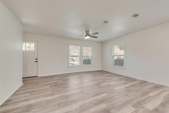 spare room featuring ceiling fan and light hardwood / wood-style flooring