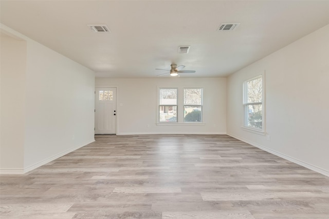 spare room with ceiling fan and light hardwood / wood-style flooring